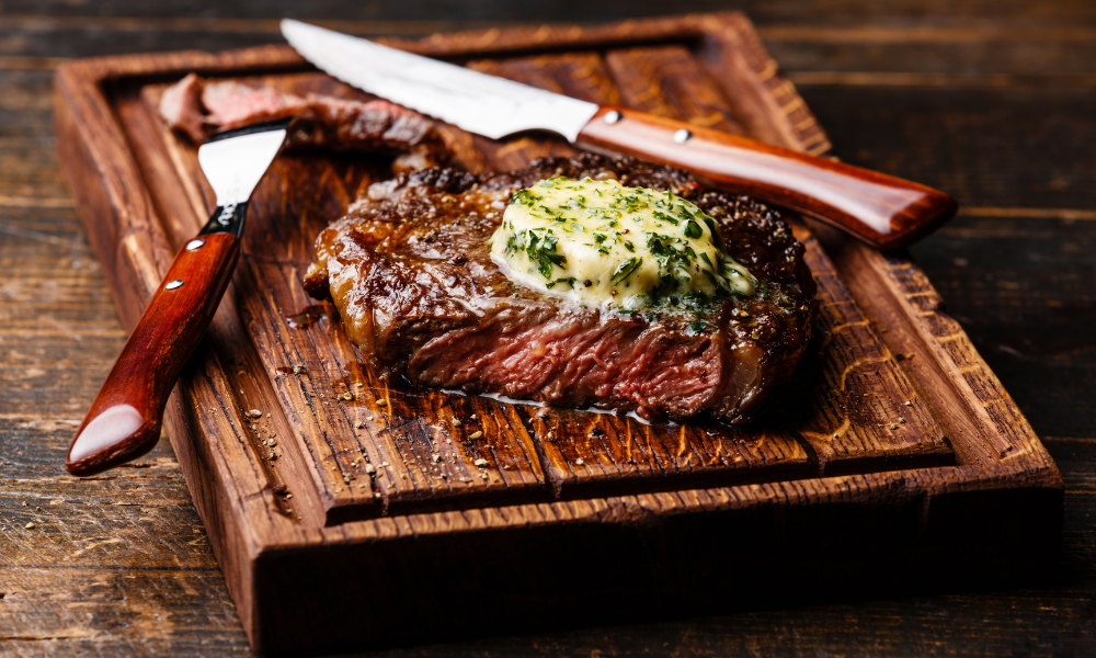Juicy steak topped with a generous dollop of melting herbs and butter