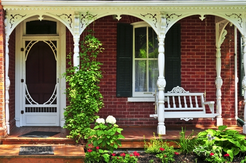 Beautiful porch of victorian house decorated with flowers